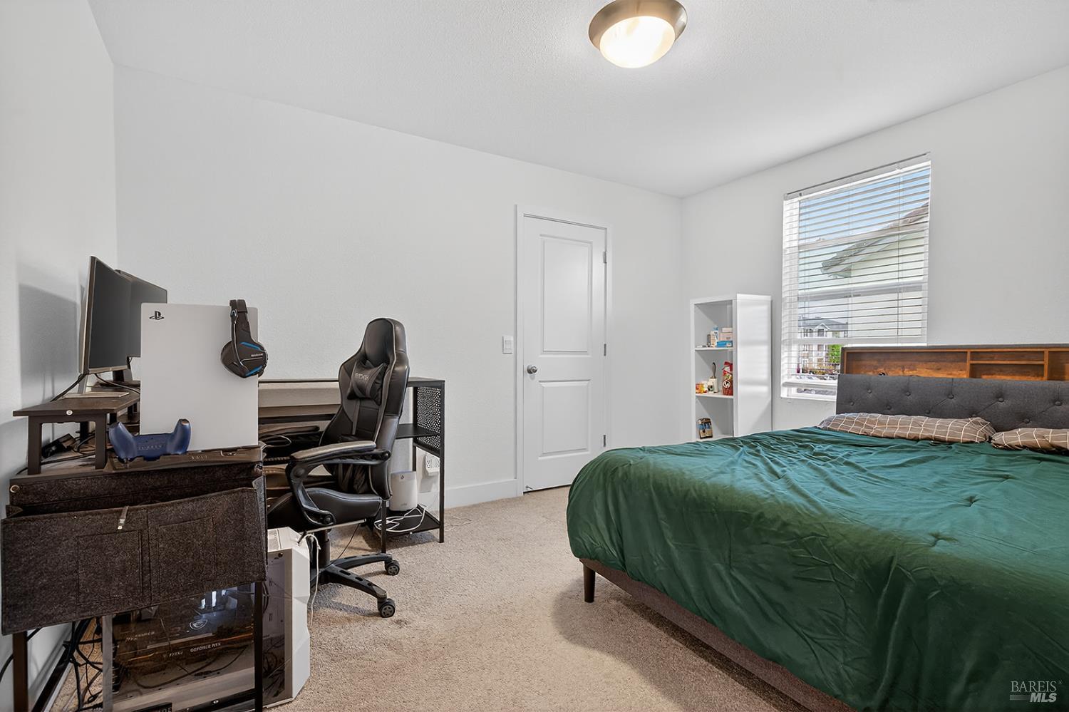 6042 Oxford Place Rohnert Park, CA 94928 - Photo 19 of 31 a bedroom with a bed and a computer on the desk