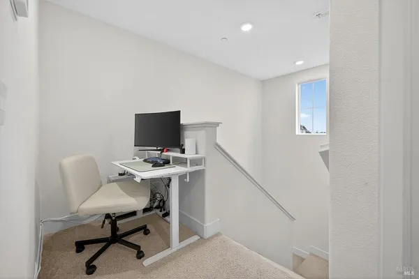 a view of a workspace with furniture