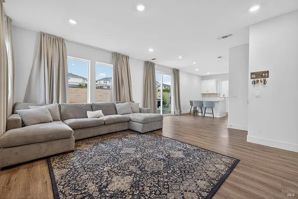 a living room with furniture and a rug