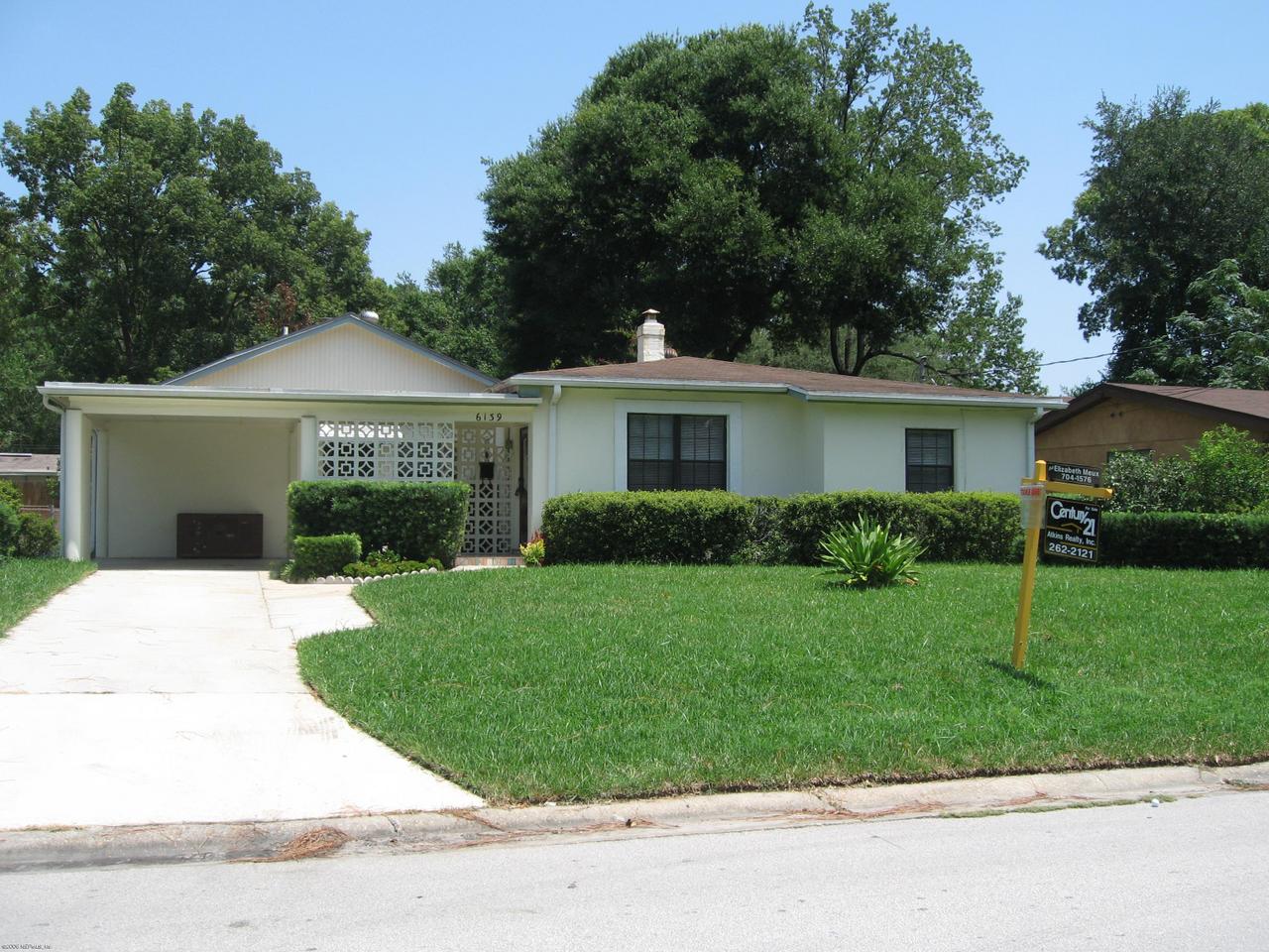 6139 Suwanee Road Jacksonville, FL 32217 - Photo 1 of 10 a view of a house with a yard and a garden