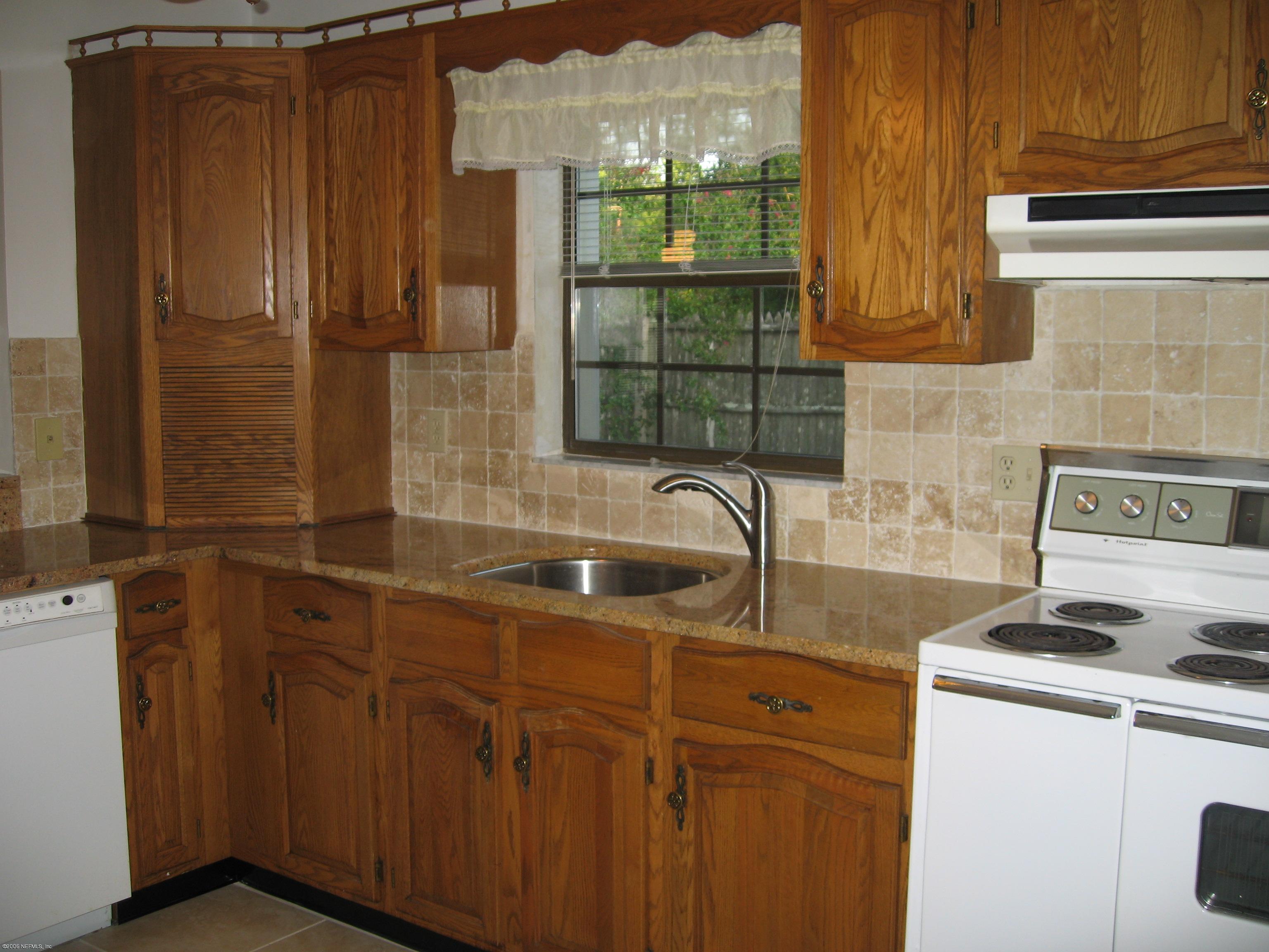 6139 Suwanee Road Jacksonville, FL 32217 - Photo 3 of 10 a bathroom with a sink and a shower