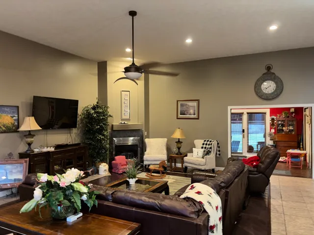 a living room with furniture and a flat screen tv