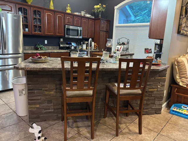 a kitchen with a sink cabinets and appliances