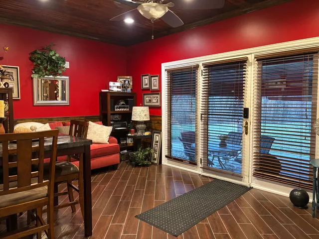 a view of a dinning room with furniture and wooden floor