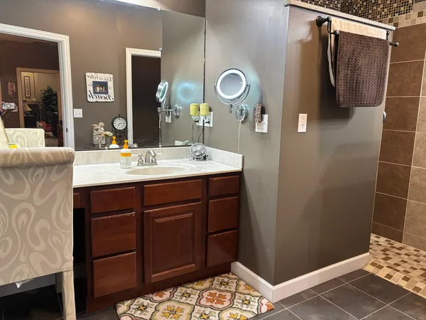 a bathroom with a sink and a mirror