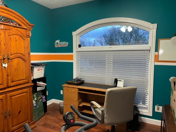 a view of a chairs and table in a backyard