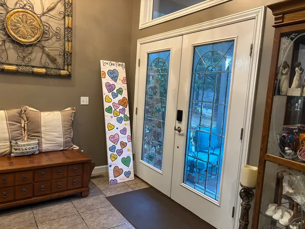 a view of an entryway with wooden floor