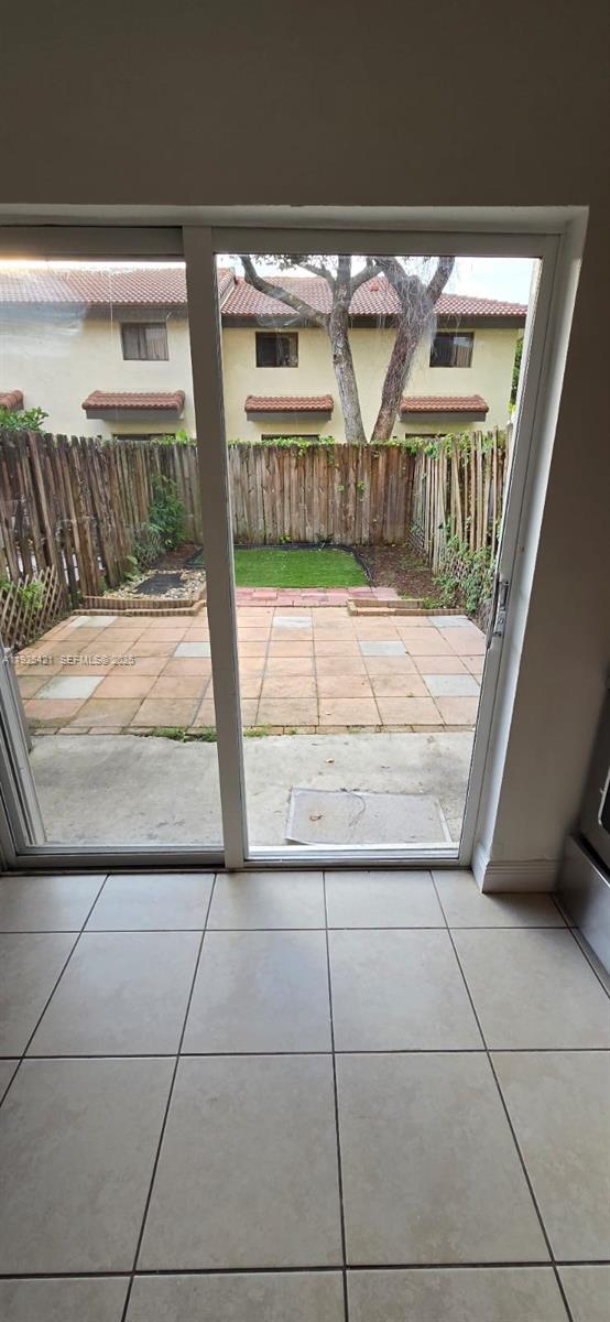 560 Northwest 82nd Place, Unit 303 Miami, FL 33126 - Photo 2 of 10 a view of a car garage door