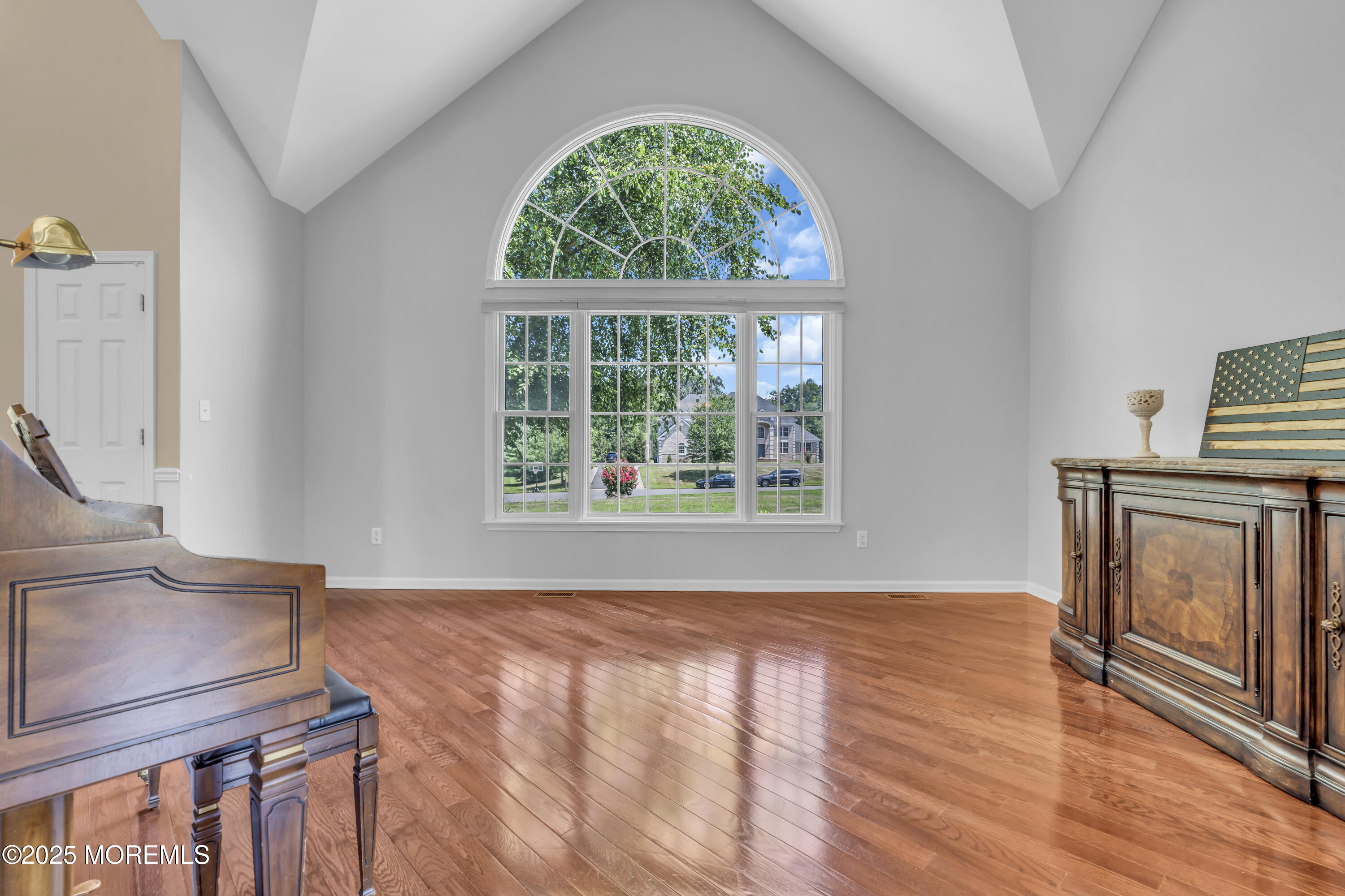 6 Cooper Court Cream Ridge, NJ 08514 - Photo 14 of 105 a view of an empty room with wooden floor and a window