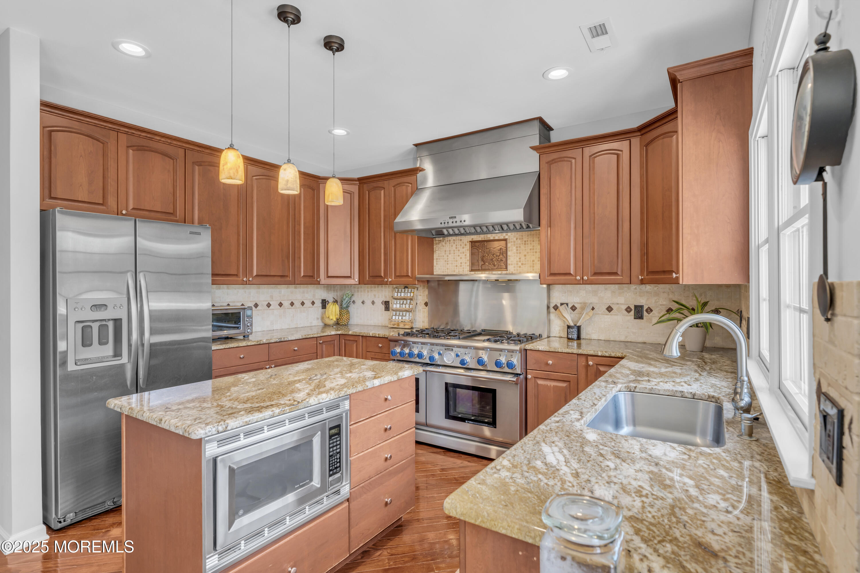 6 Cooper Court Cream Ridge, NJ 08514 - Photo 20 of 105 a kitchen with stainless steel appliances granite countertop a refrigerator a sink dishwasher a stove with wooden cabinets and floor