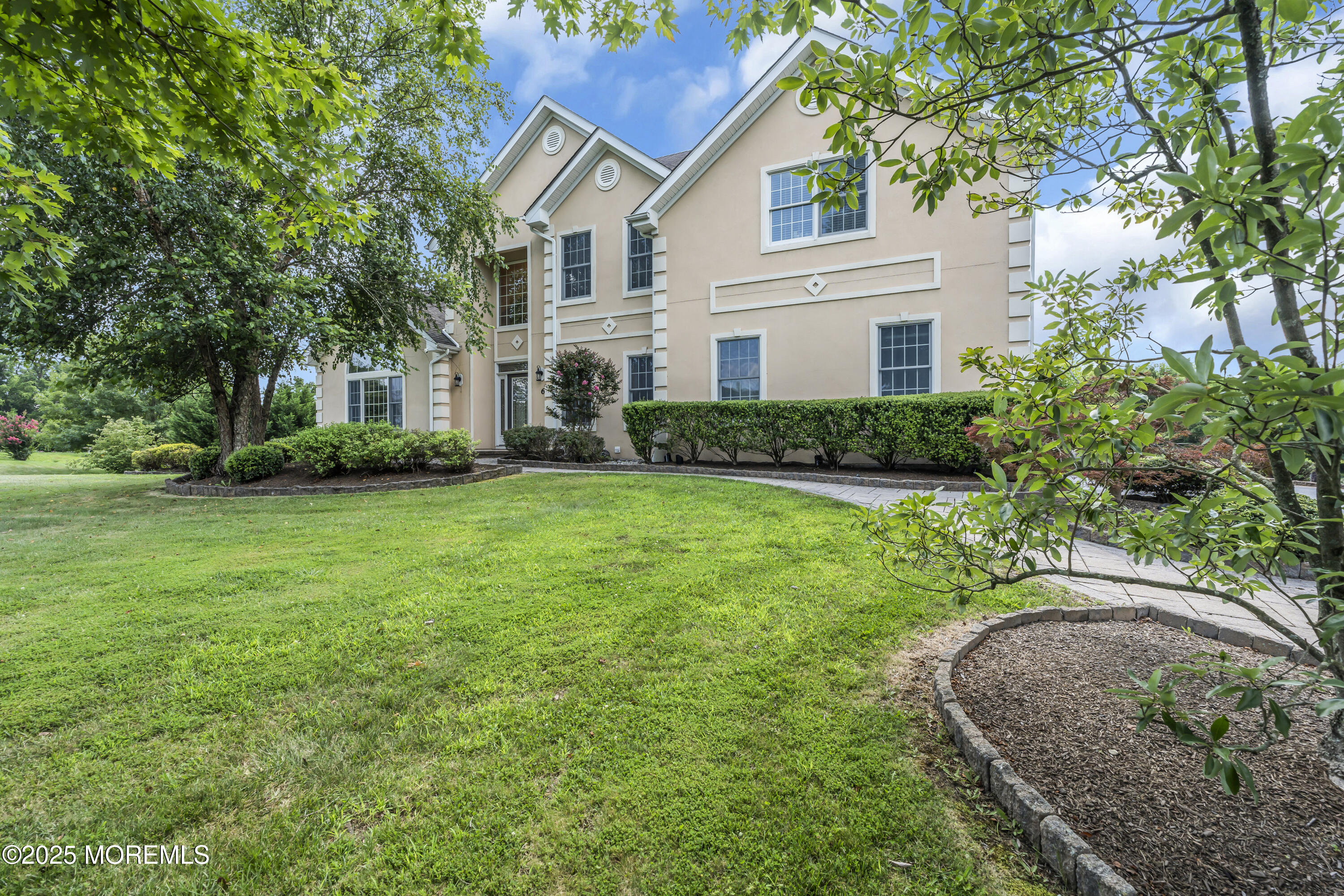 6 Cooper Court Cream Ridge, NJ 08514 - Photo 2 of 105 a front view of a house with a garden