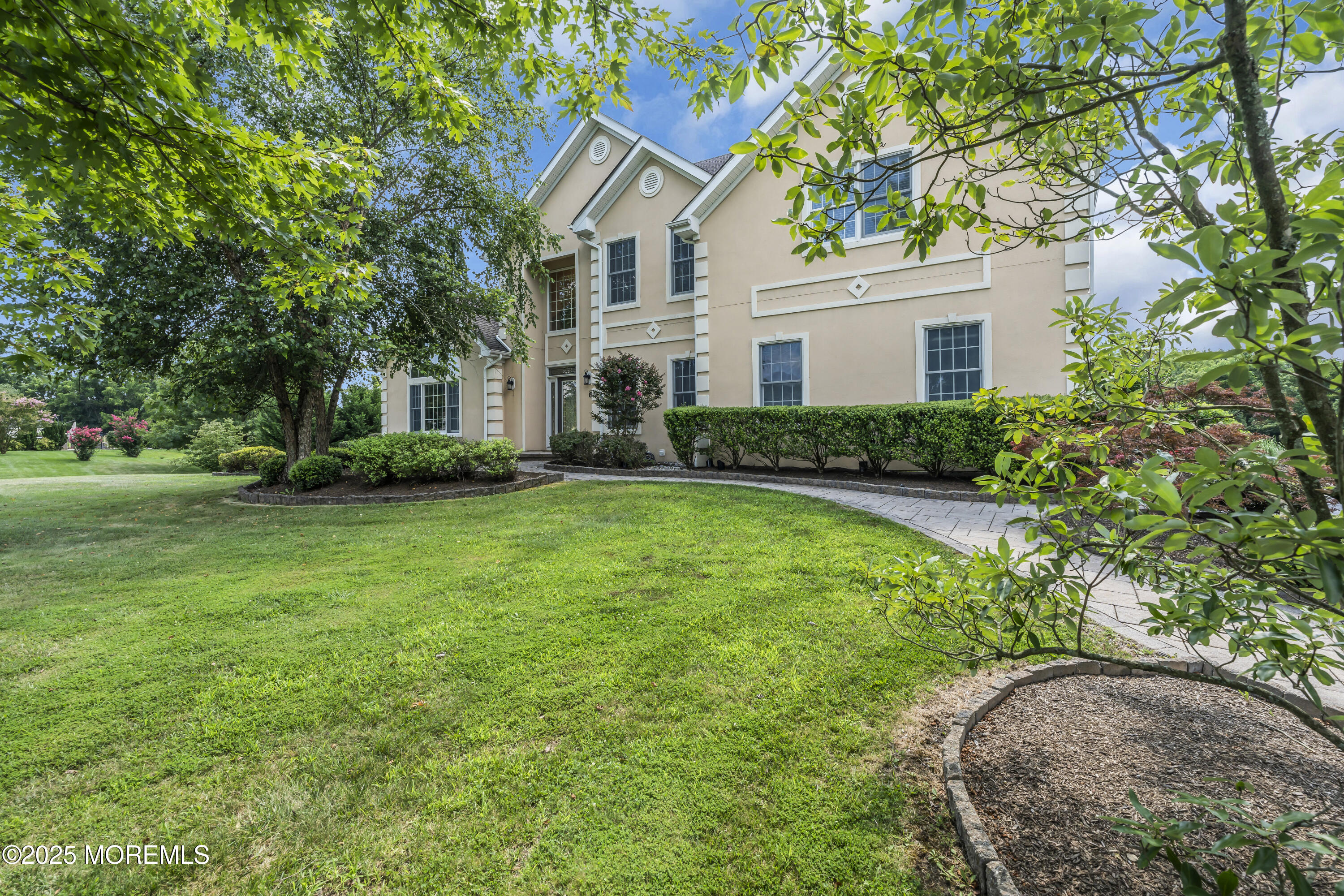 6 Cooper Court Cream Ridge, NJ 08514 - Photo 3 of 105 a front view of a house with a yard and trees