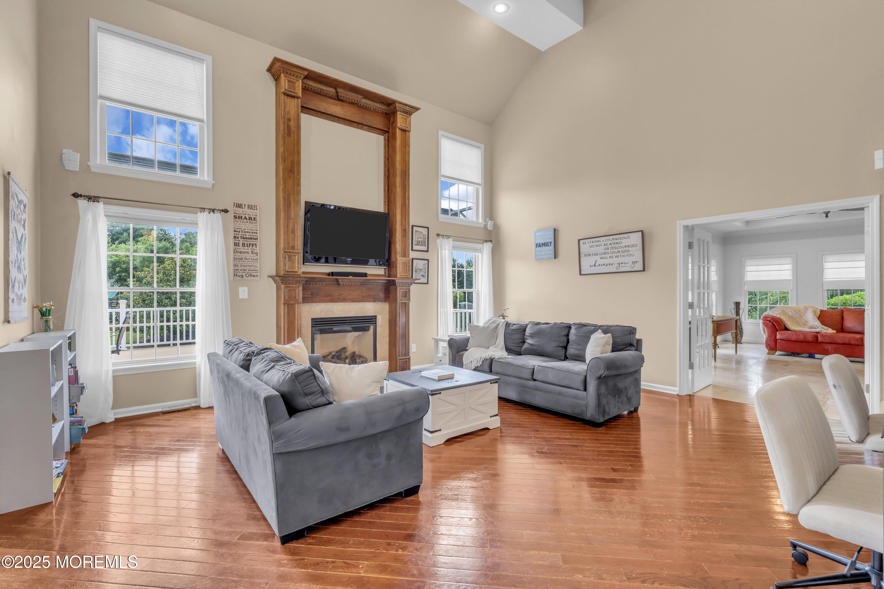 6 Cooper Court Cream Ridge, NJ 08514 - Photo 34 of 105 a living room with fireplace furniture and a flat screen tv