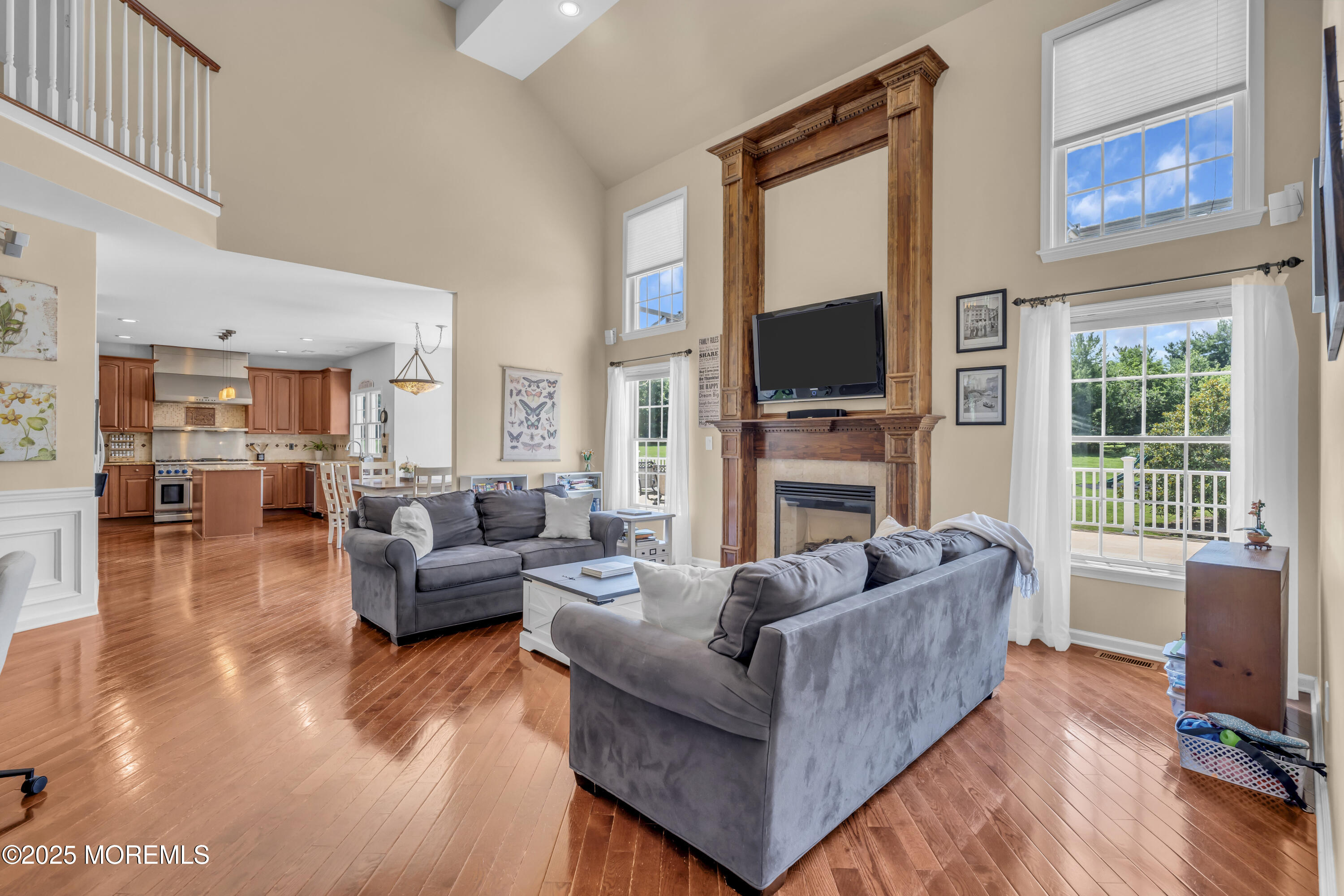 6 Cooper Court Cream Ridge, NJ 08514 - Photo 38 of 105 a living room with fireplace furniture and a flat screen tv