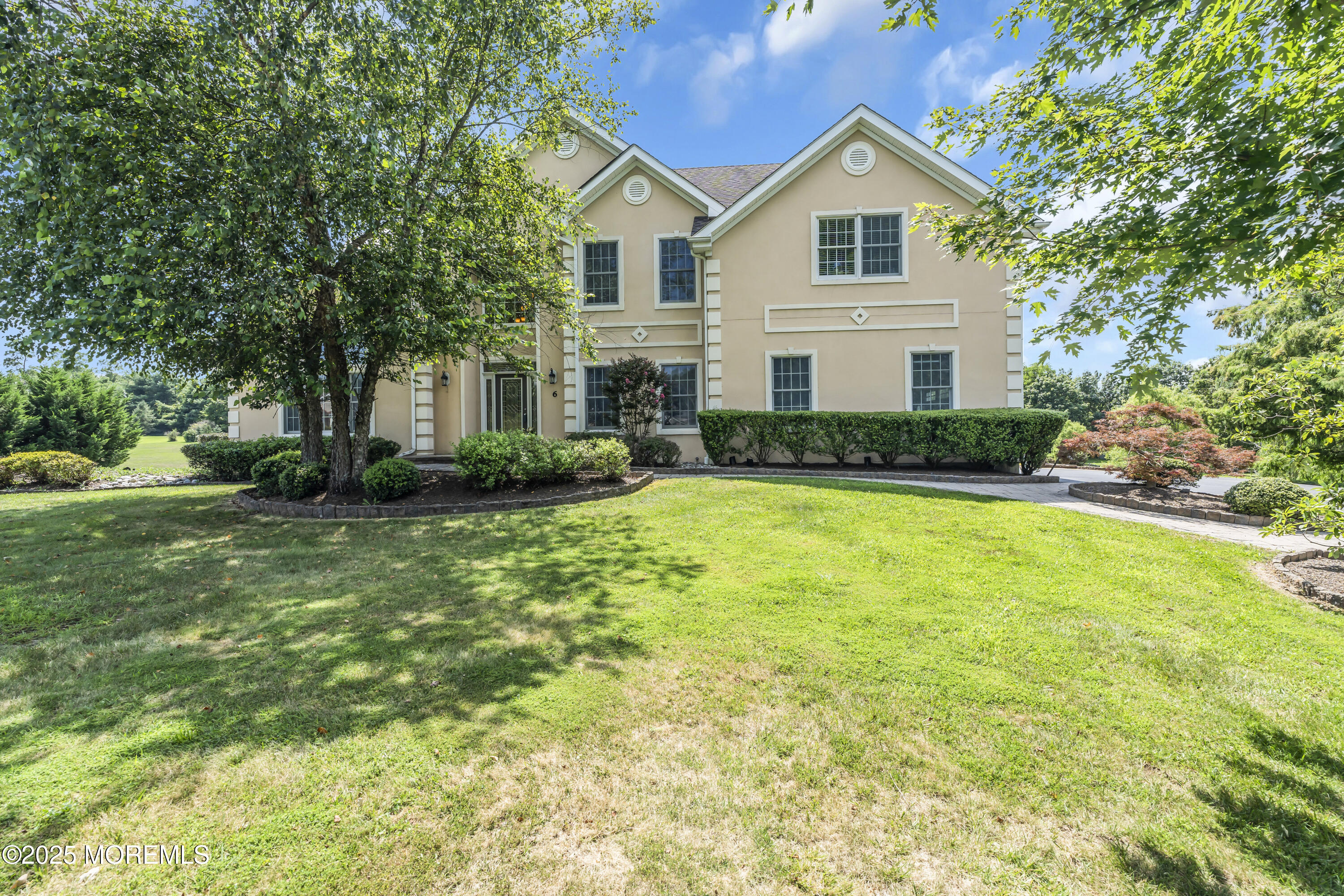 6 Cooper Court Cream Ridge, NJ 08514 - Photo 4 of 105 a front view of a house with a yard