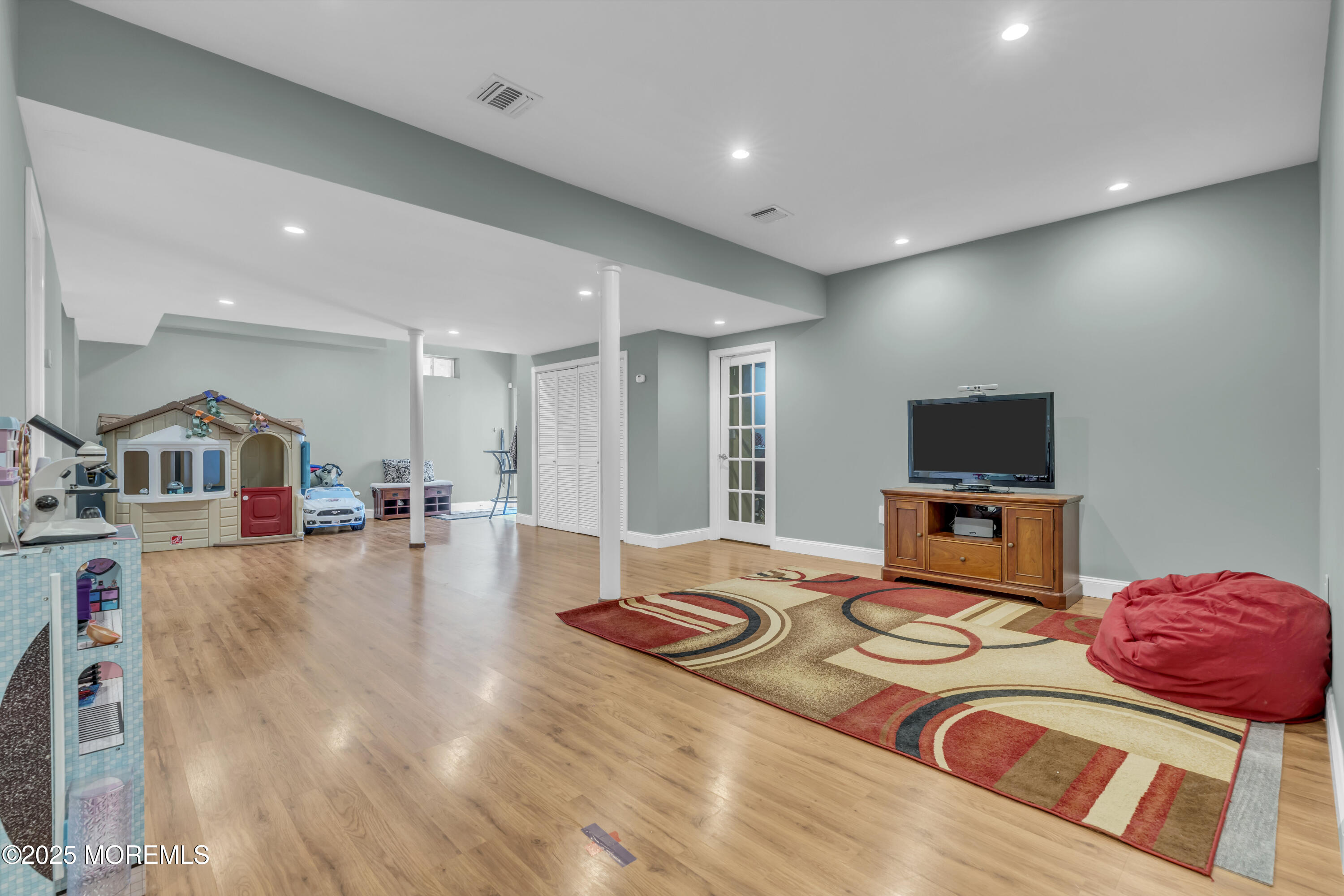 6 Cooper Court Cream Ridge, NJ 08514 - Photo 61 of 105 a living room with furniture and a flat screen tv
