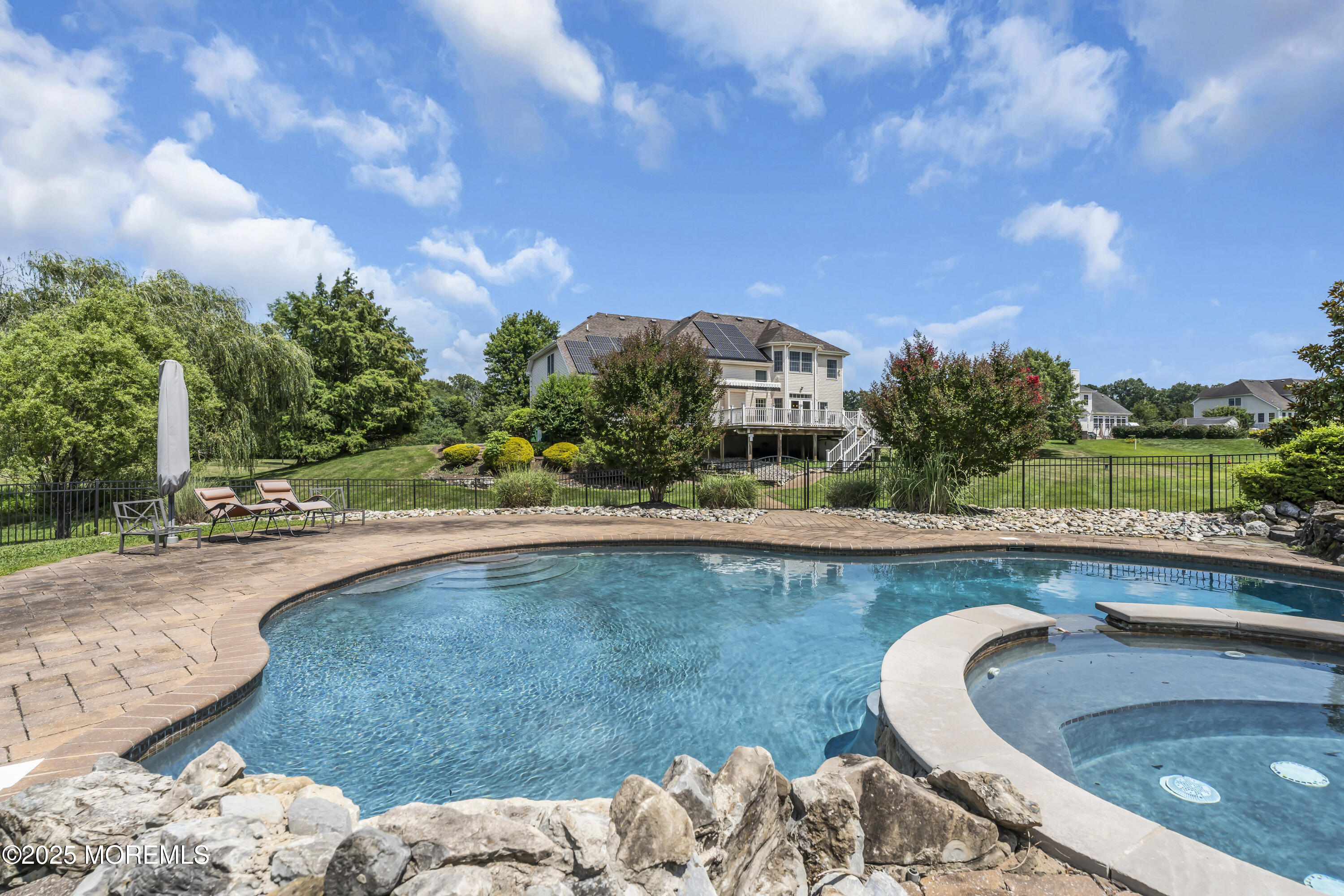 6 Cooper Court Cream Ridge, NJ 08514 - Photo 72 of 105 a swimming pool with outdoor seating and plants