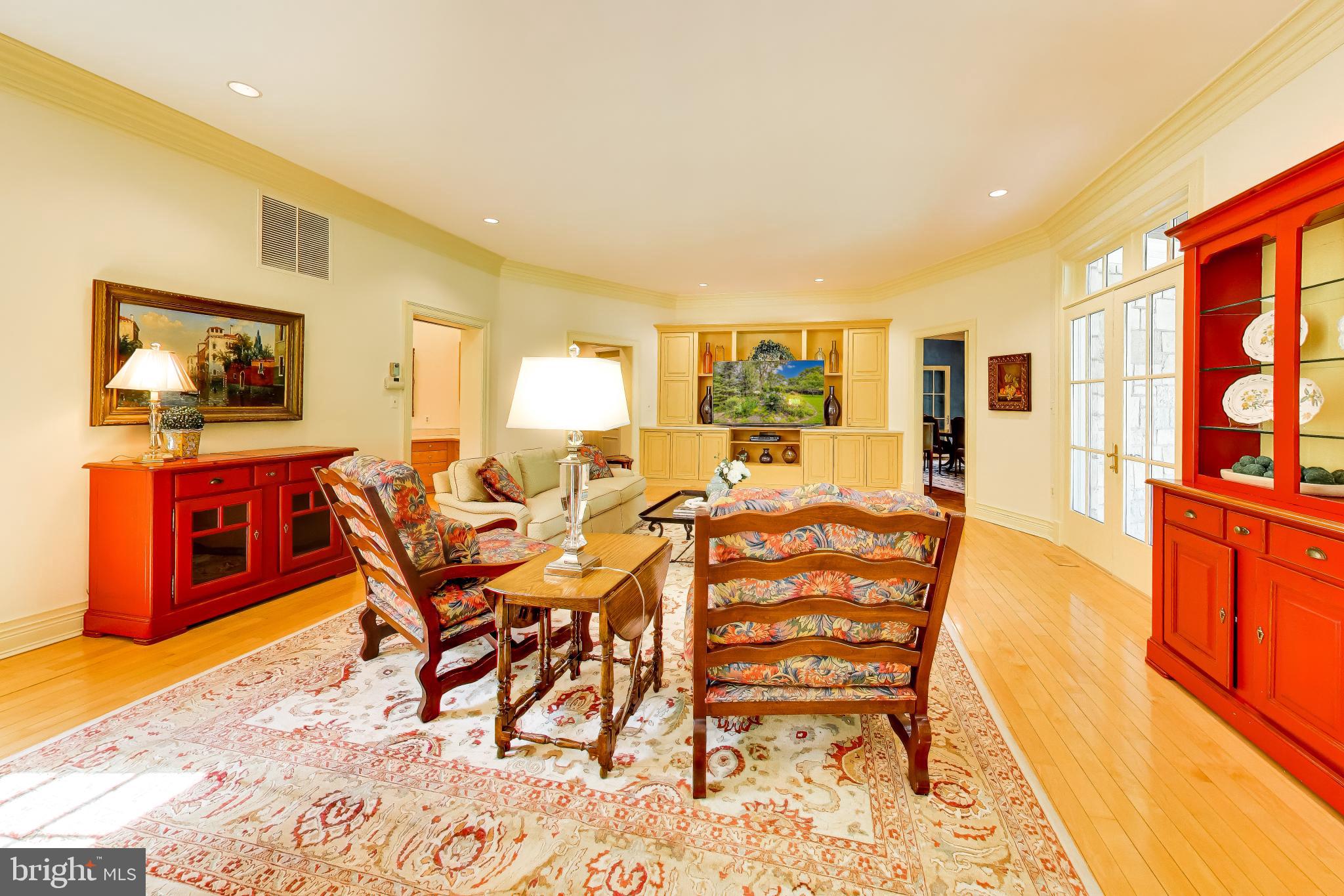 9001 Persimmon Tree Road Potomac, MD 20854 - Photo 21 of 77 a dining room with furniture and wooden floor