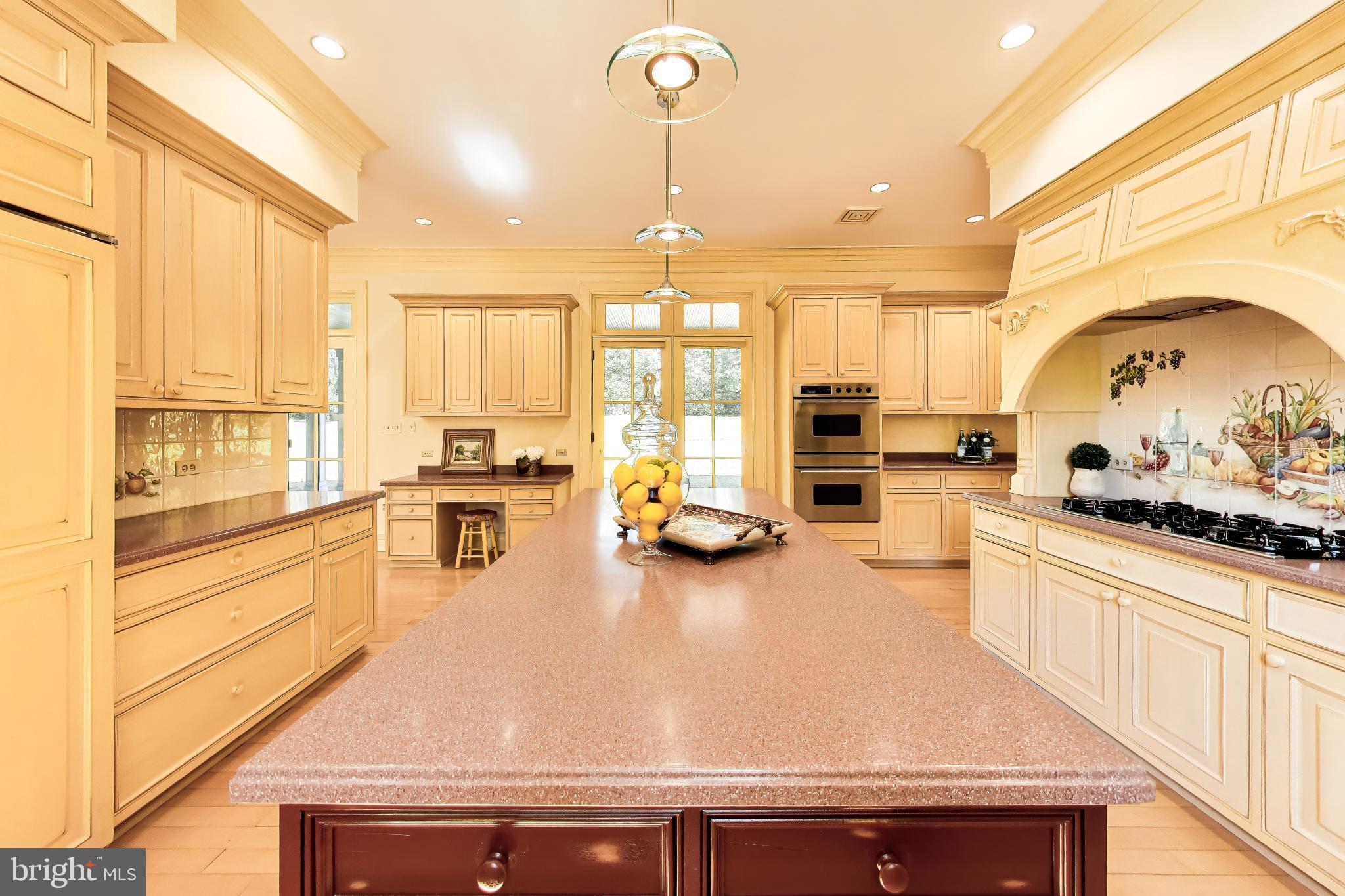 9001 Persimmon Tree Road Potomac, MD 20854 - Photo 27 of 77 a kitchen with sink refrigerator and large window