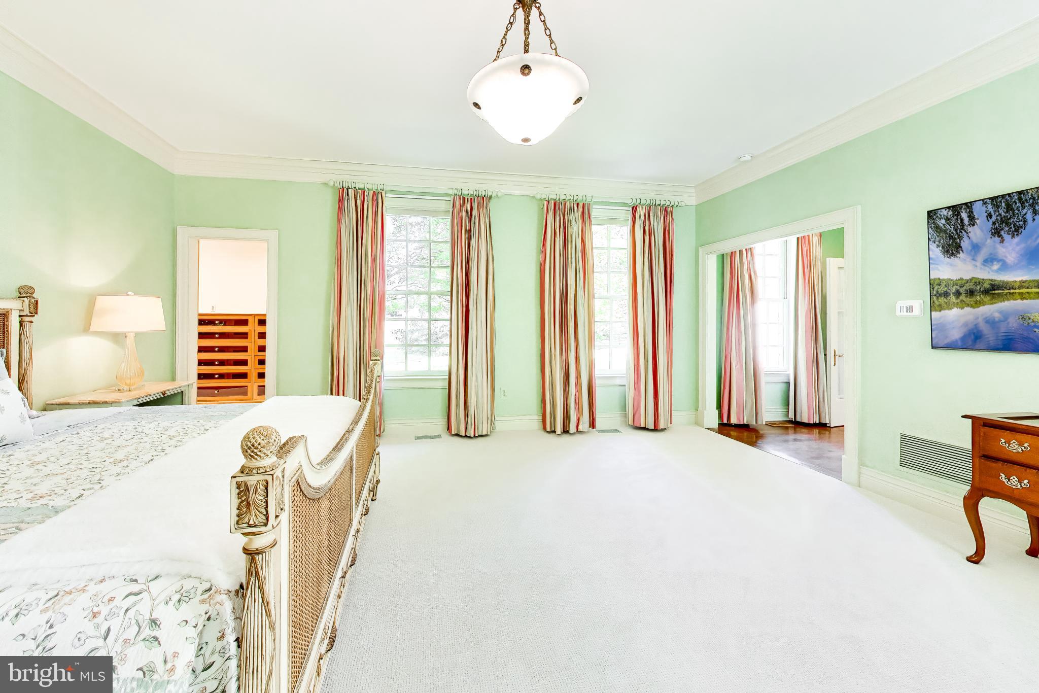 9001 Persimmon Tree Road Potomac, MD 20854 - Photo 30 of 77 a view of a bedroom with furniture and windows