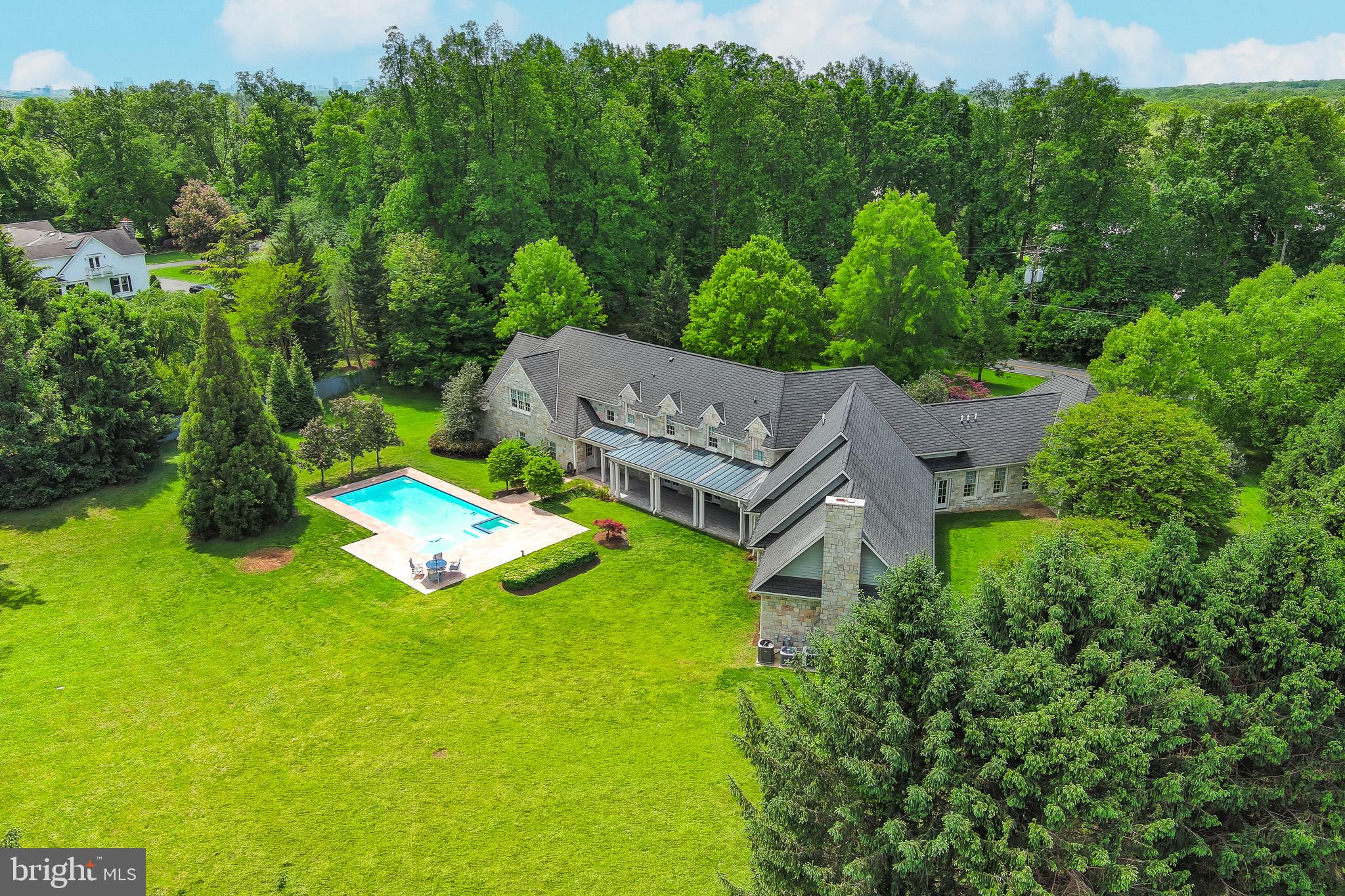 9001 Persimmon Tree Road Potomac, MD 20854 - Photo 3 of 77 an aerial view of a house with a yard