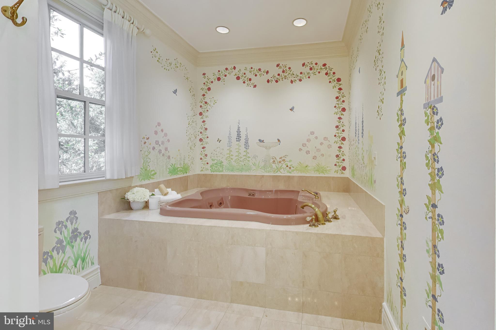 9001 Persimmon Tree Road Potomac, MD 20854 - Photo 33 of 77 a bath tub sitting in a bathroom next to a window