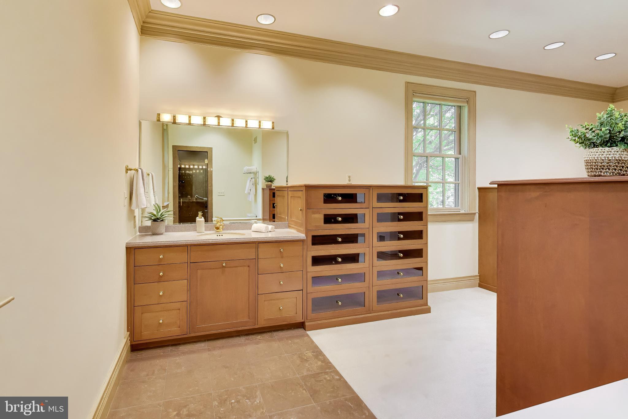 9001 Persimmon Tree Road Potomac, MD 20854 - Photo 34 of 77 a spacious bathroom with a shower and a sink