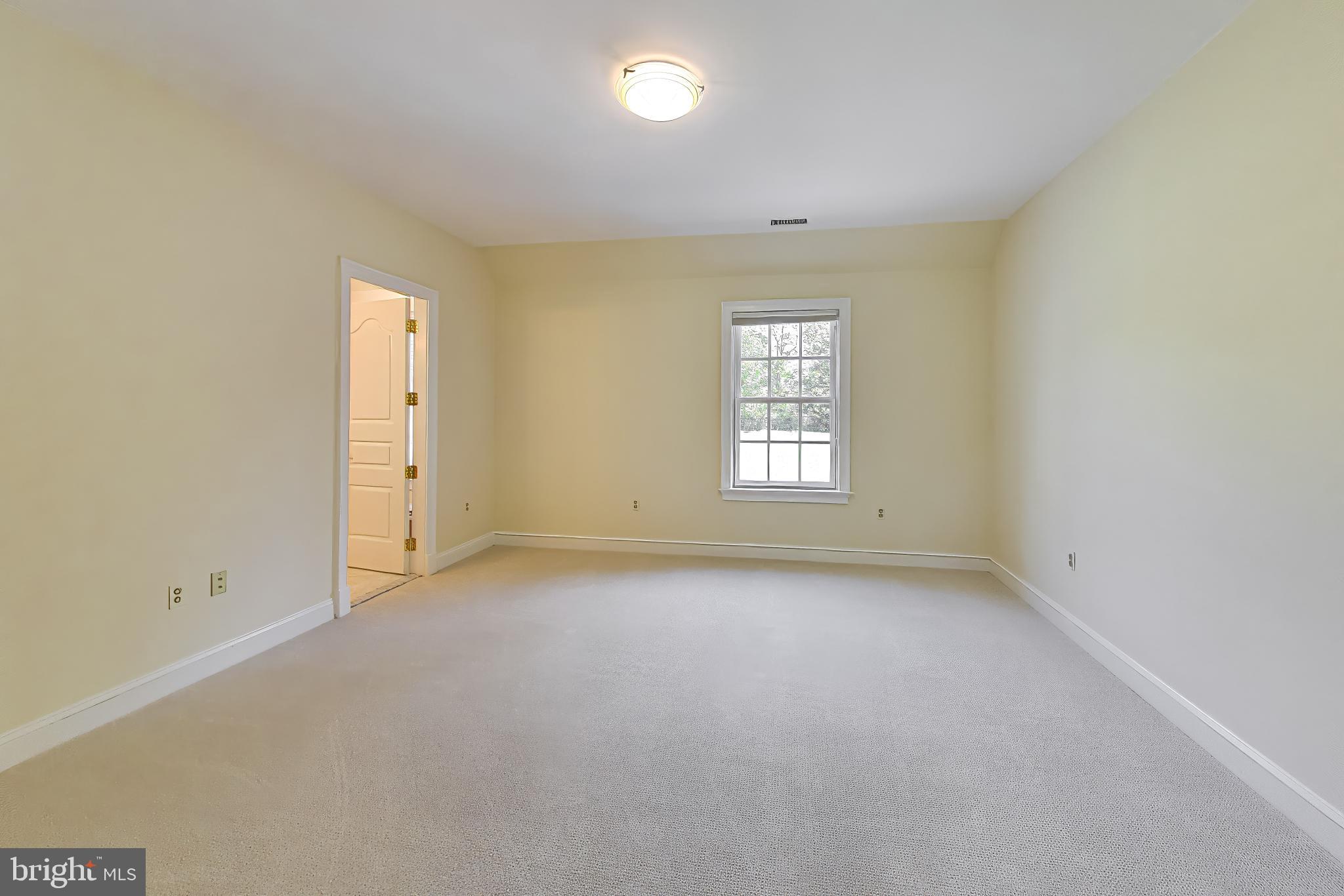 9001 Persimmon Tree Road Potomac, MD 20854 - Photo 39 of 77 an empty room with windows and closet