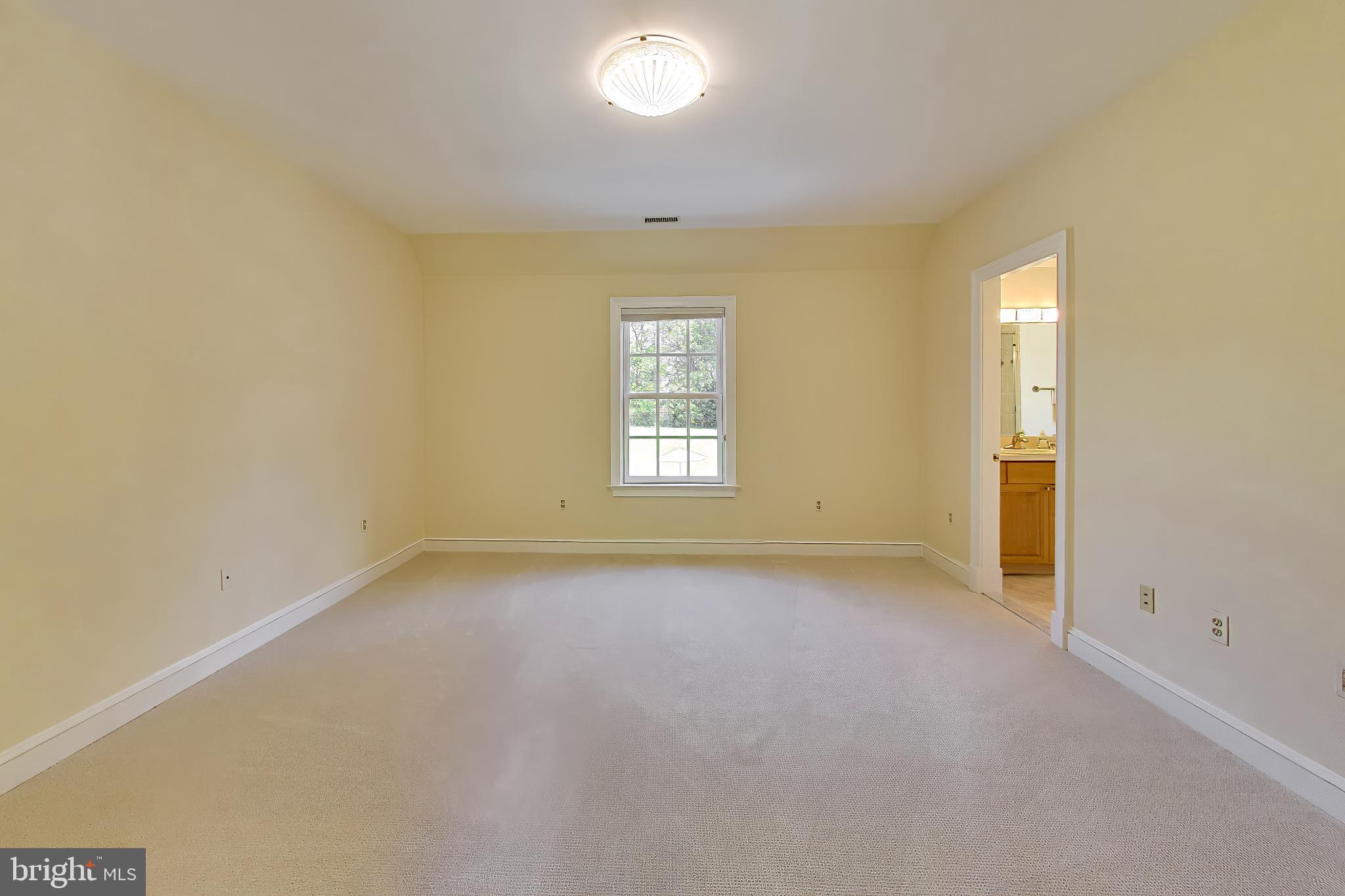 9001 Persimmon Tree Road Potomac, MD 20854 - Photo 42 of 77 an empty room with windows and closet