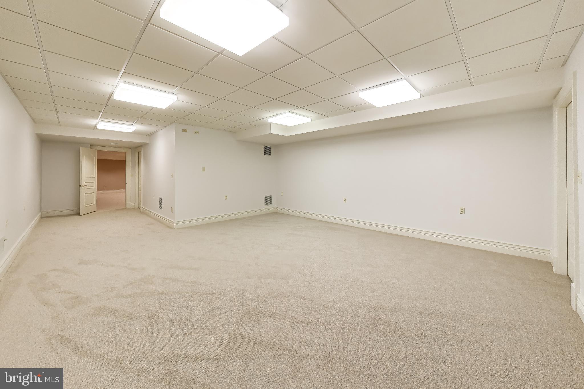 9001 Persimmon Tree Road Potomac, MD 20854 - Photo 62 of 77 an empty room with windows