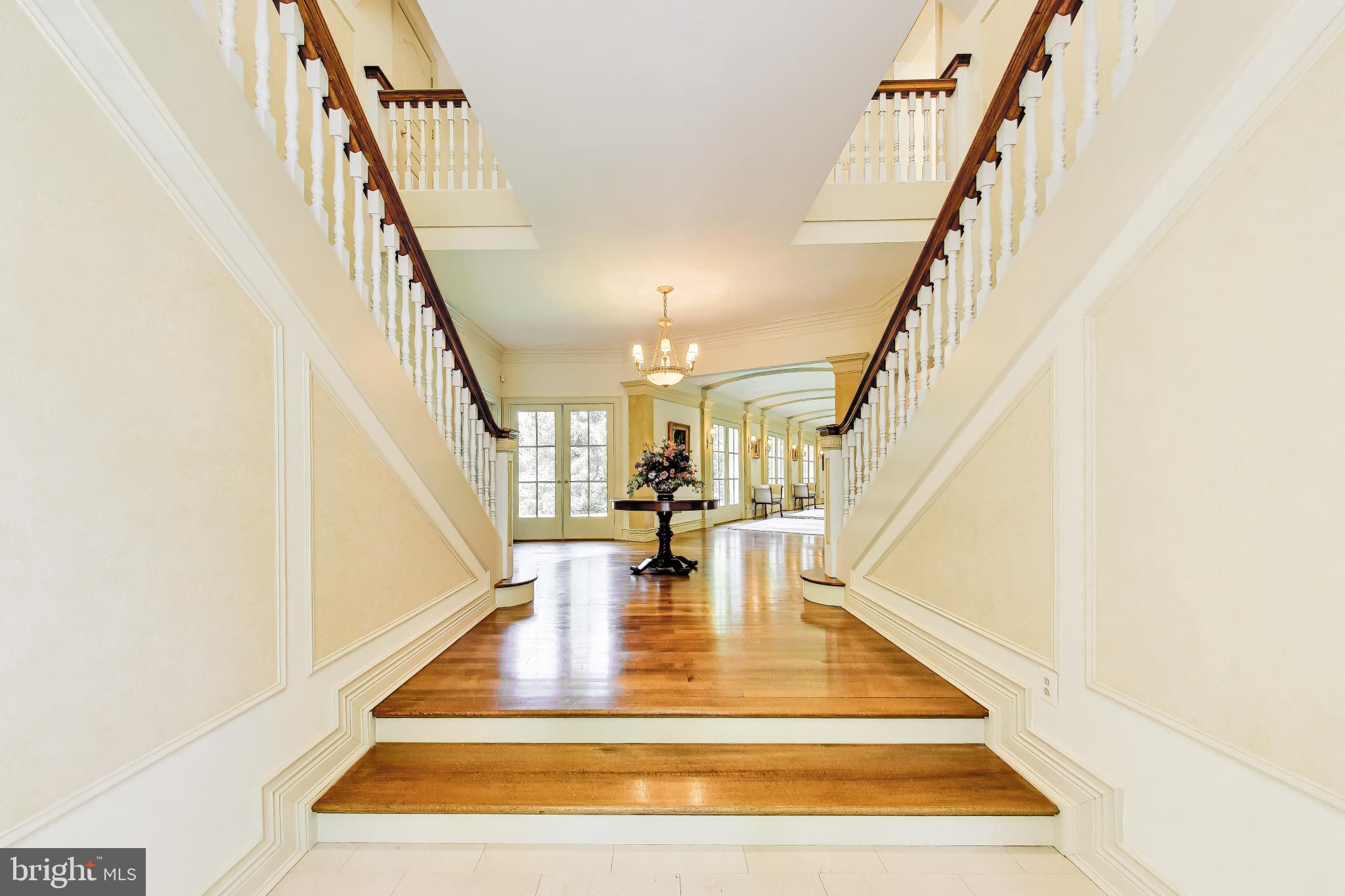 9001 Persimmon Tree Road Potomac, MD 20854 - Photo 7 of 77 a view of entryway and hall with wooden floor