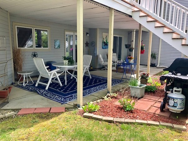 204 Beacon Park Road, Unit 204 Webster, MA 01570 - Photo 3 of 29 a view of a backyard with sitting area
