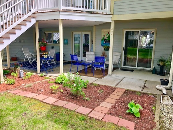 204 Beacon Park Road, Unit 204 Webster, MA 01570 - Photo 4 of 29 a view of a lounge chairs in a patio