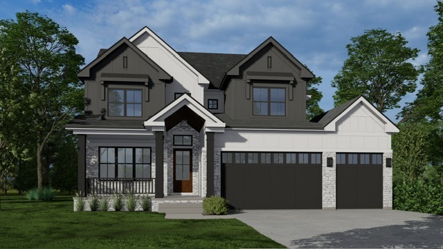 a front view of a house with a yard and trees