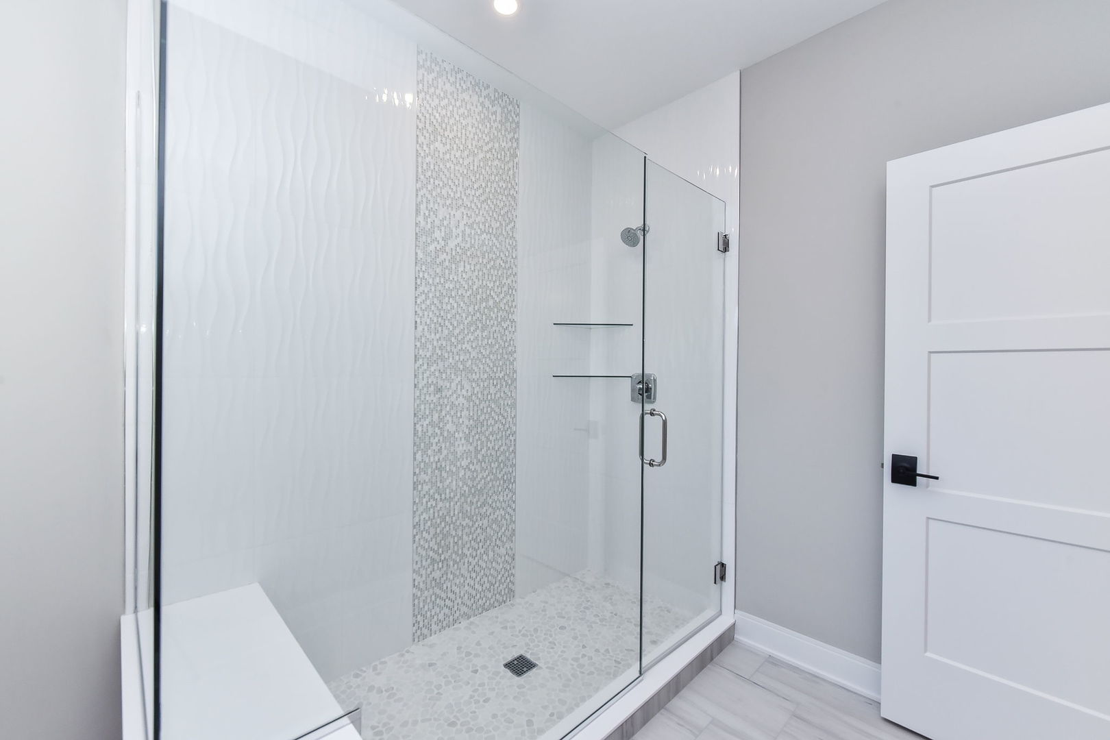 744 Sunset Drive Naperville, IL 60540 - Photo 8 of 18 a bathroom with a glass shower door