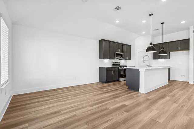 a bathroom with a sink a mirror and a bathtub