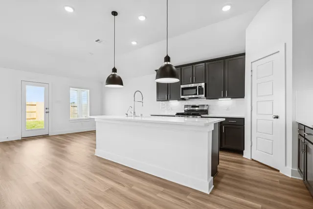 a bathroom with a double vanity sink and mirror