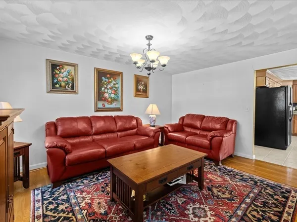 a kitchen with stainless steel appliances granite countertop a sink cabinets and a stove