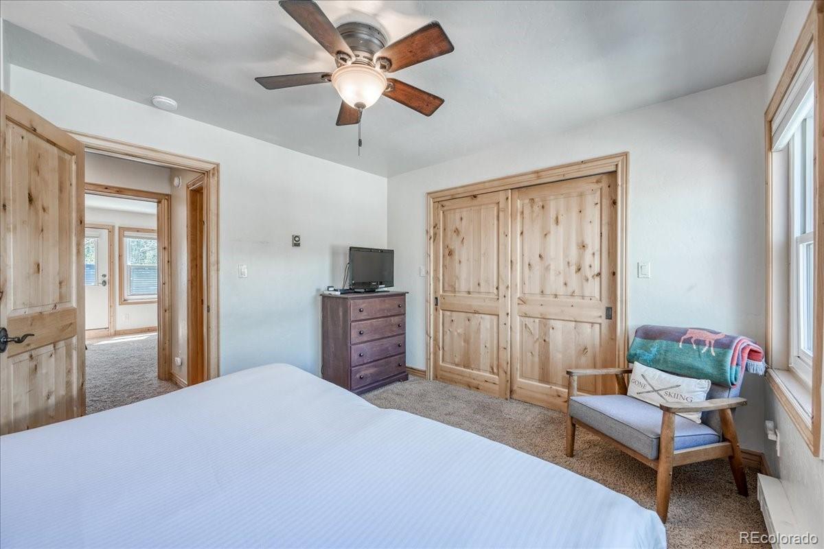 200 North Ridge Street, Unit R1 Breckenridge, CO 80424 - Photo 21 of 27 a bedroom with a bed and a chandelier
