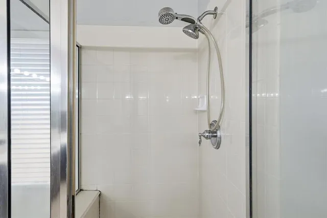 a living room with a bed furniture and a window