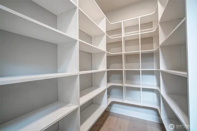 a spacious bathroom with a double vanity sink tub and mirror