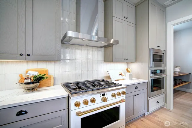 a kitchen with a dining table and chairs