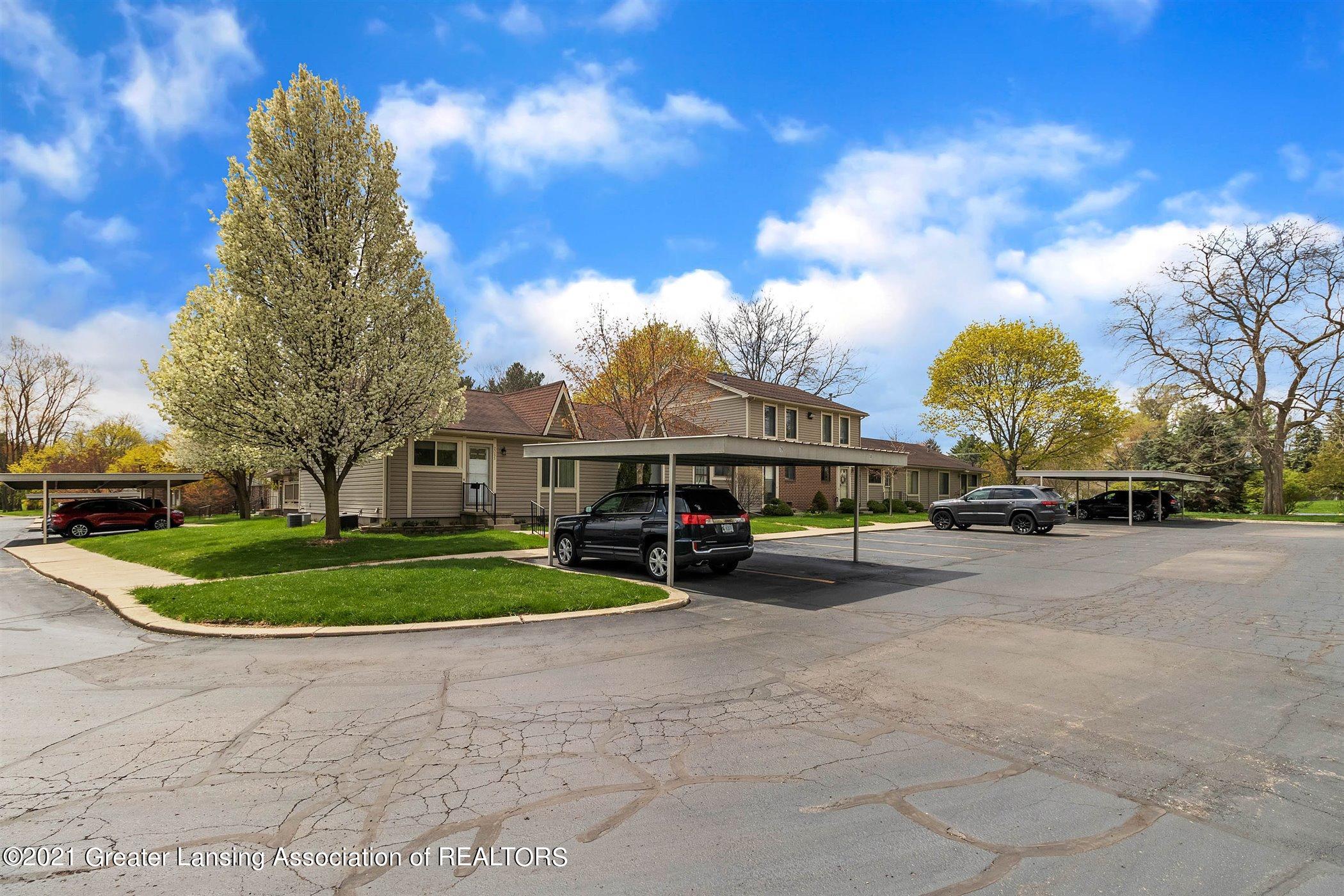 2089 East Lake Lansing Road, Unit 81 Haslett, MI 48840 - Photo 32 of 35 02-2089 Lake Lansing Rd-WindowStill-Real