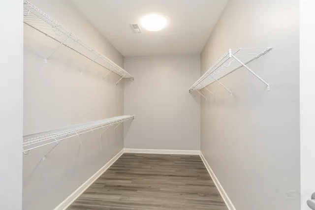 a view of an empty walk in closet