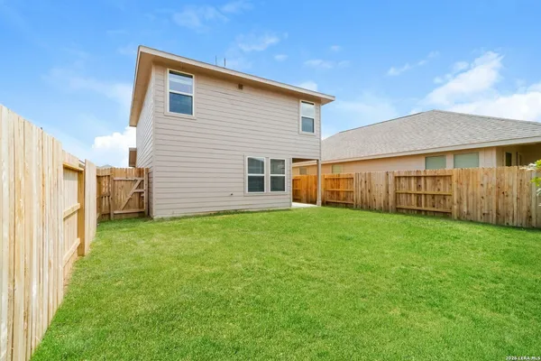 a view of a backyard of the house