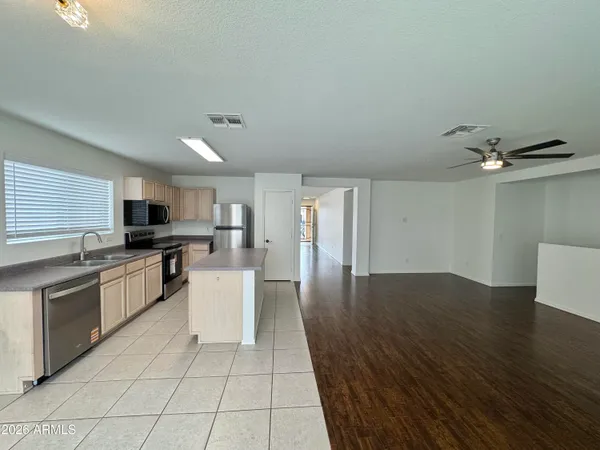a kitchen with a sink cabinets and stainless steel appliances