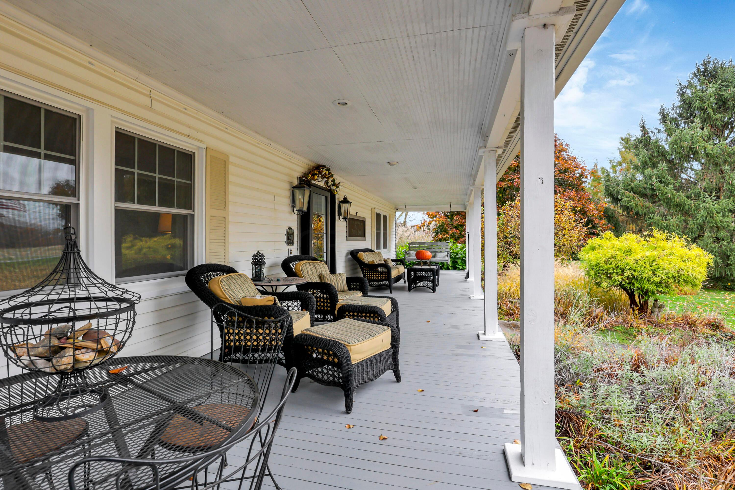 7601 Chatham Road Northeast Newark, OH 43055 - Photo 5 of 78 Lemonade in the shade on your covered front porch!