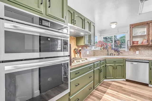 a bedroom with a bed dresser and a window