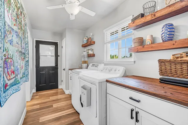 a bathroom with a sink a mirror and a window