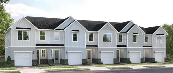 a view of a big house with a street